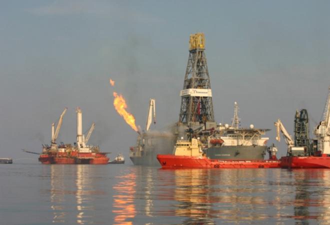 Two months after Deepwater Horizon exploded and sank, site response efforts were still burning natural gas captured from the ruptured well. © David Valentine